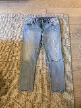 Levi's 501 Light Blue Slim Straight Jeans with Distressed Details